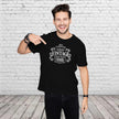 Man pointing at the Vintage 1996 Aged to Perfection print on his black 30th birthday t-shirt