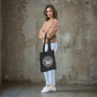 Being 30 is a Work of Art 30th birthday tote bag in black carried over the shoulder