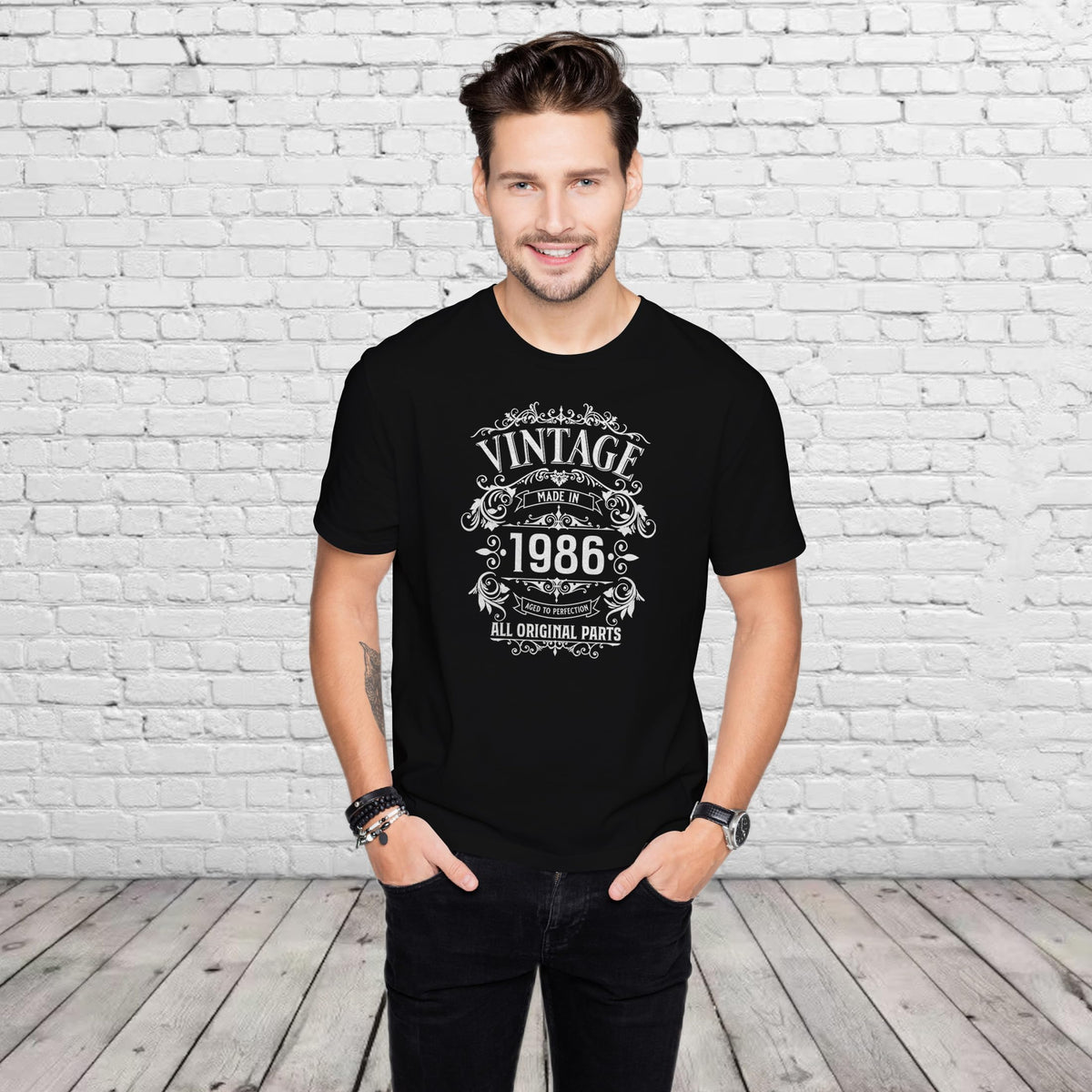 Man wearing the Vintage 1986 All Original Parts 40th birthday t-shirt in black