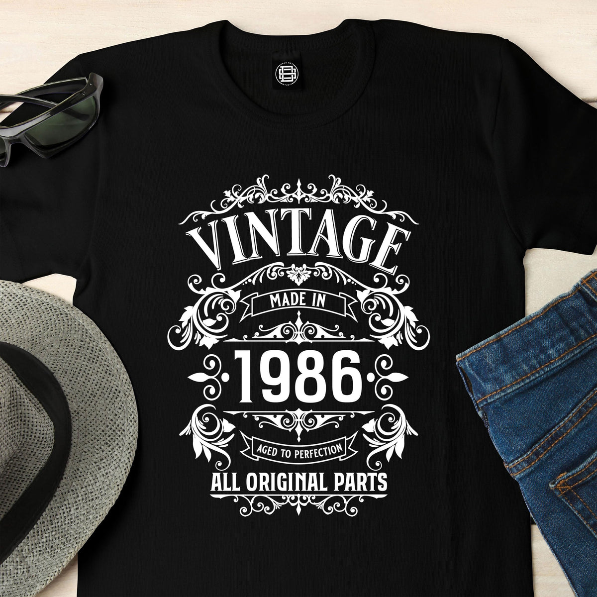 Close-up of the Vintage 1986 All Original Parts print on a black 40th birthday t-shirt