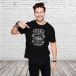 Man pointing at the Vintage 1986 All Original Parts print on his black 40th birthday t-shirt
