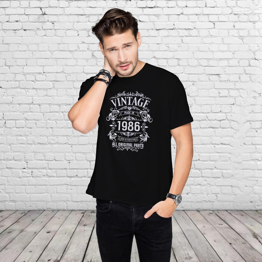 Smiling man in the black Vintage 1986 All Original Parts 40th birthday t-shirt