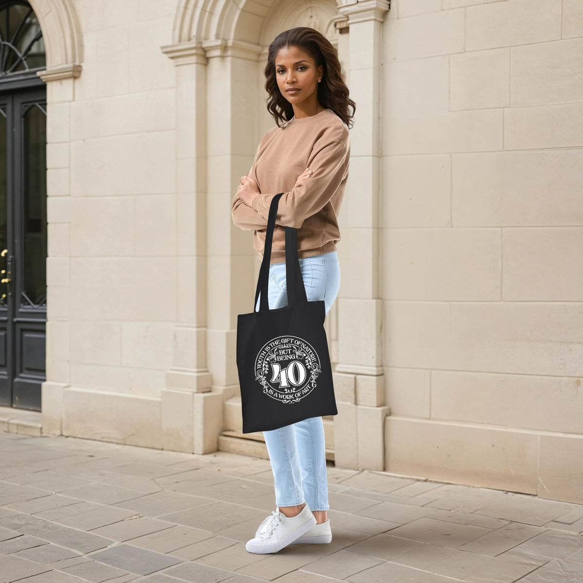 Being 40 is a Work of Art 40th birthday tote bag in black carried over the shoulder