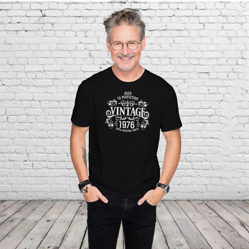 Man wearing the Vintage 1976 Aged to Perfection 50th birthday t-shirt in black