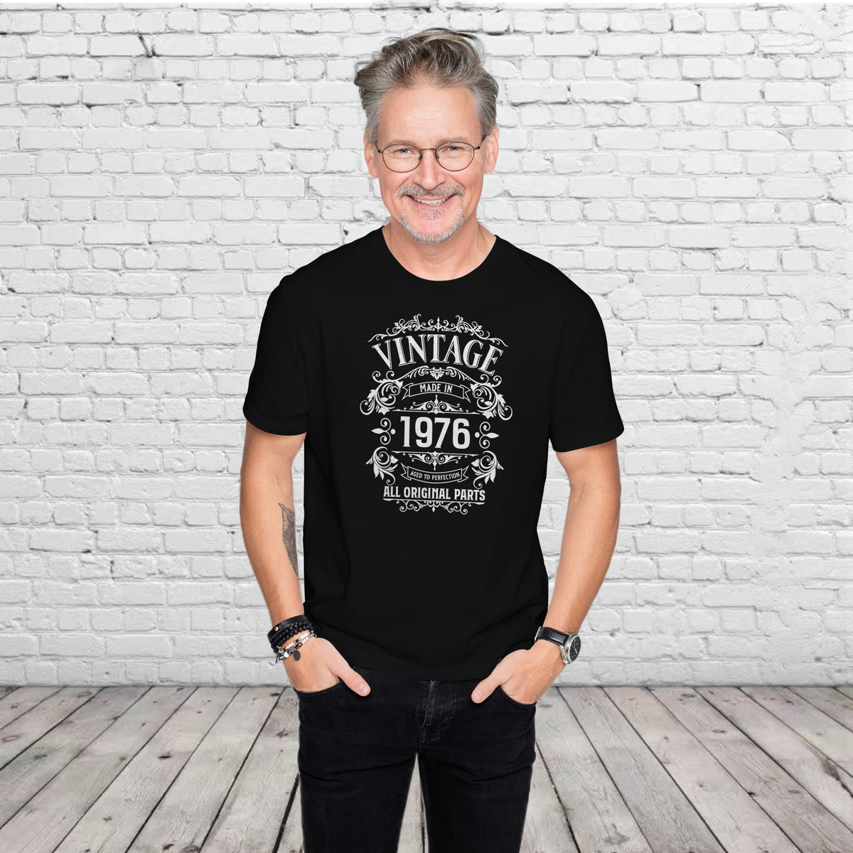 Man wearing the Vintage 1976 All Original Parts 50th birthday t-shirt in black