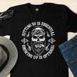 Close-up of the Hitting 50 is Essential print on a black 50th birthday t-shirt