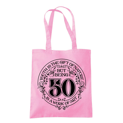 Being 50 is a Work of Art 50th birthday tote bag in classic pink