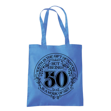 Being 50 is a Work of Art 50th birthday tote bag in cornflower blue