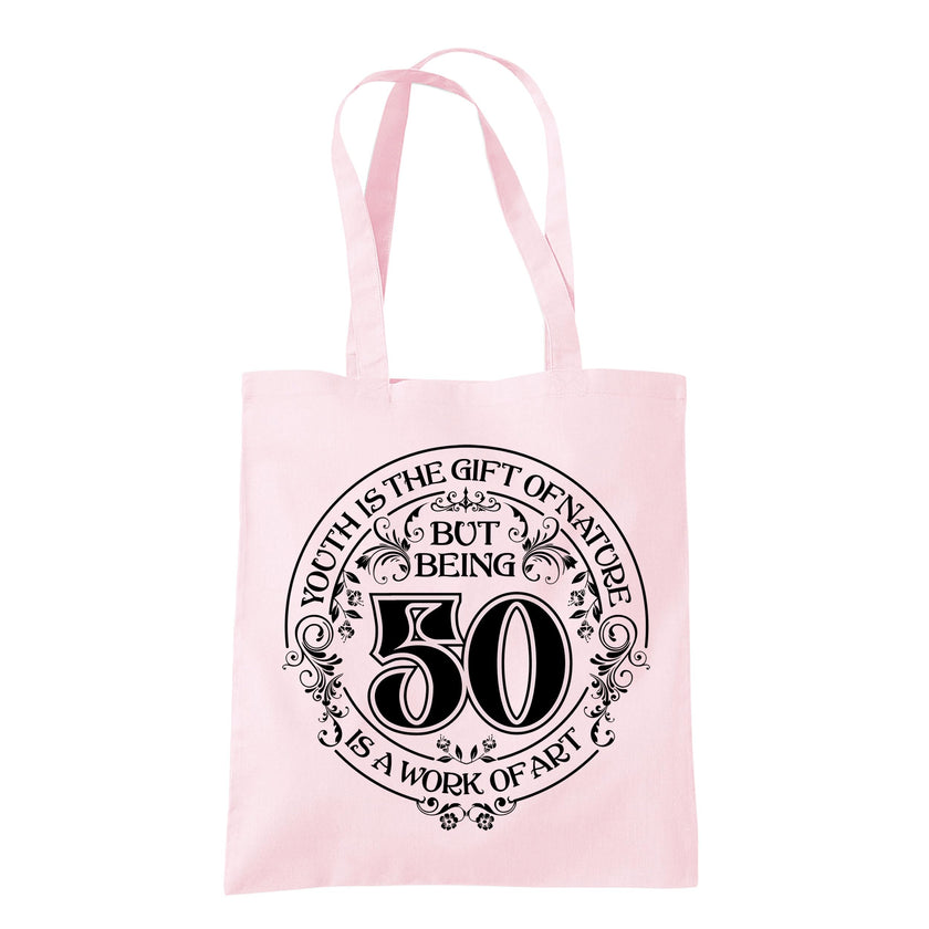 Being 50 is a Work of Art 50th birthday tote bag in pastel pink