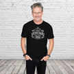 Man wearing the Vintage 1966 Aged to Perfection 60th birthday t-shirt in black