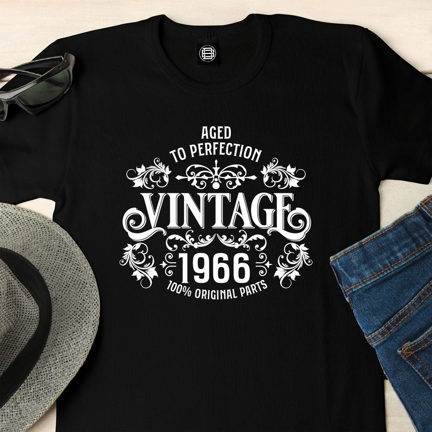 Close-up of the Vintage 1966 Aged to Perfection print on a black 60th birthday t-shirt