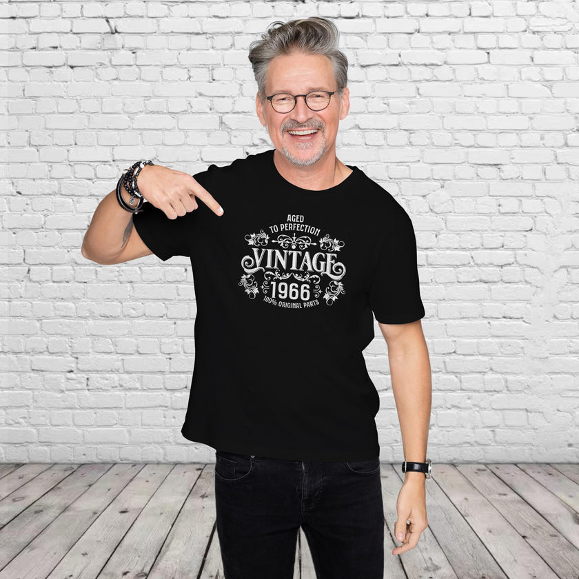 Man pointing at the Vintage 1966 Aged to Perfection print on his black 60th birthday t-shirt