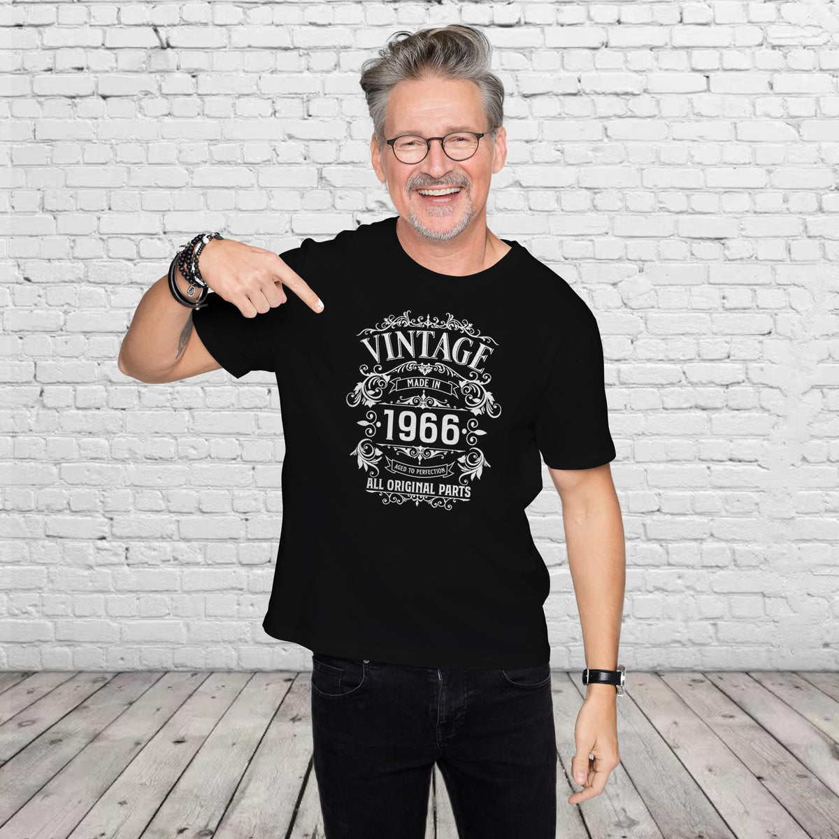 Man pointing at the Vintage 1966 All Original Parts print on his black 60th birthday t-shirt