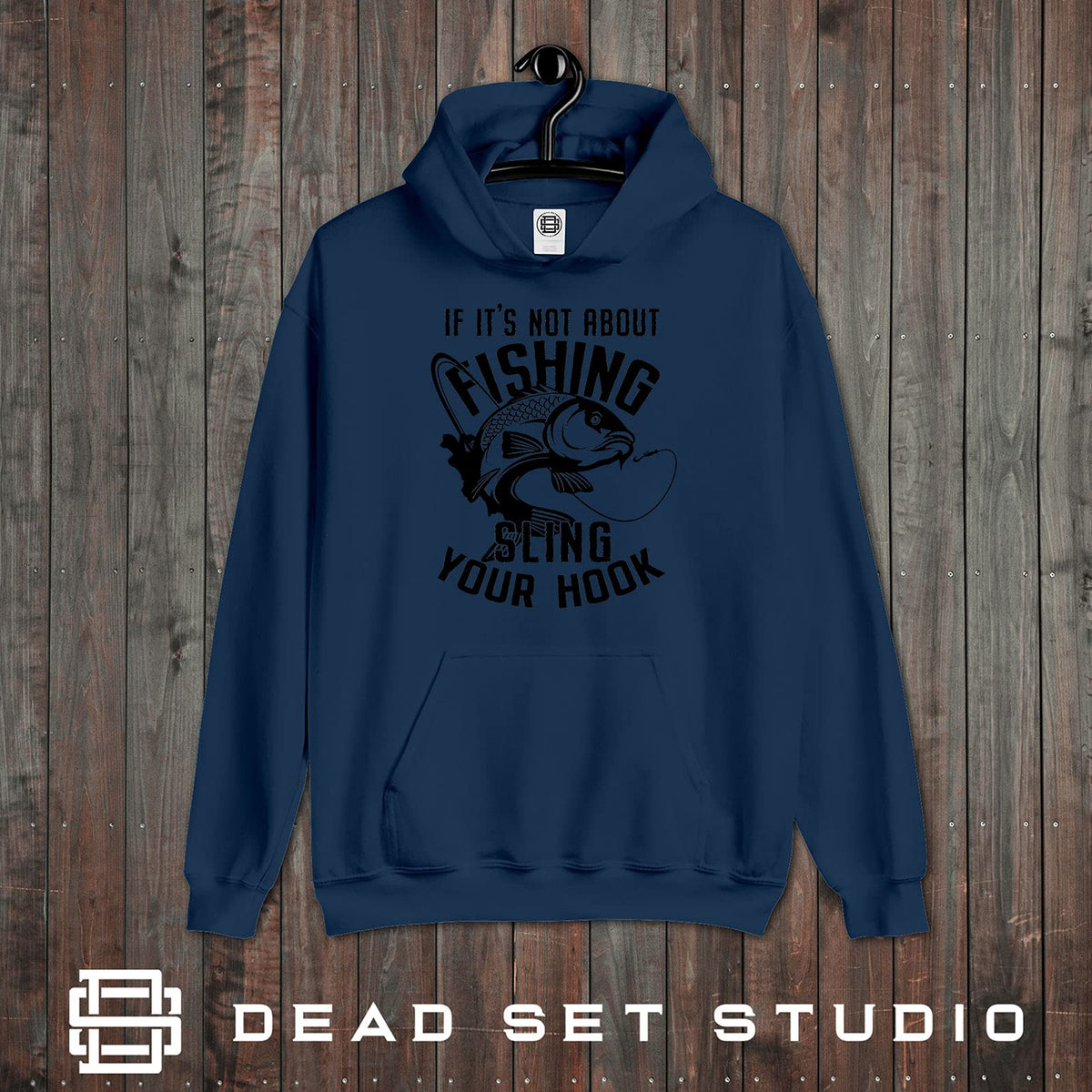 Sling Your Hook carp fishing hoodie in airforce blue on a rustic wood background