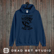Sling Your Hook carp fishing hoodie in airforce blue on a rustic wood background