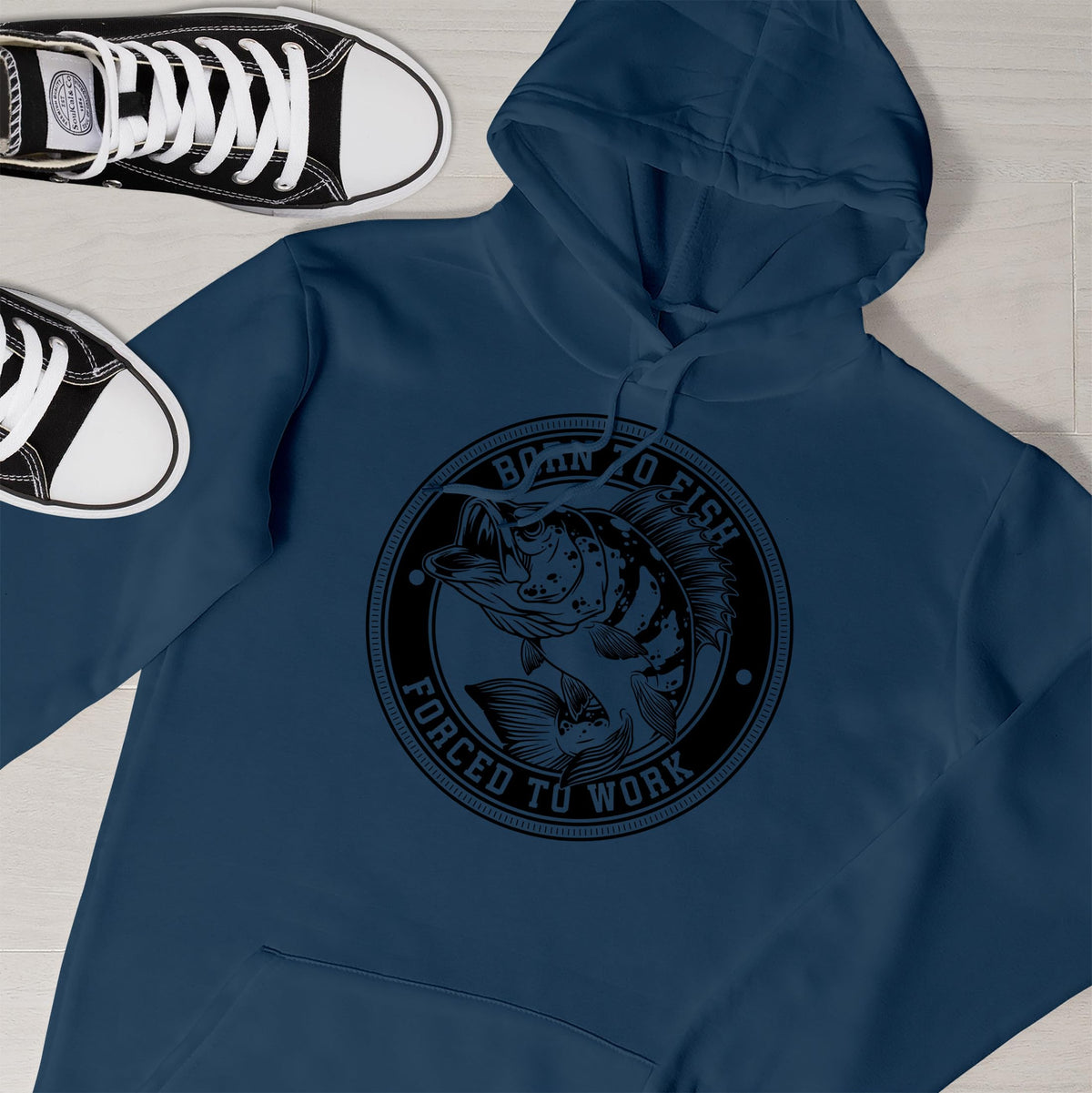 Close-up of the Born to Fish print on an airforce blue fishing hoodie