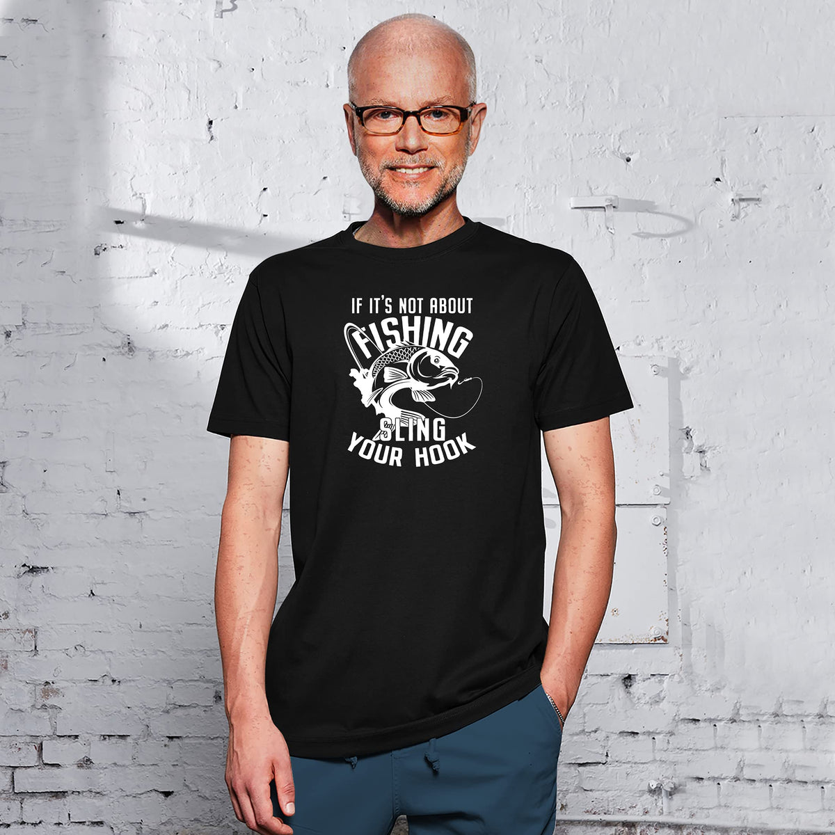 Smiling man in the black Sling Your Hook fishing t-shirt