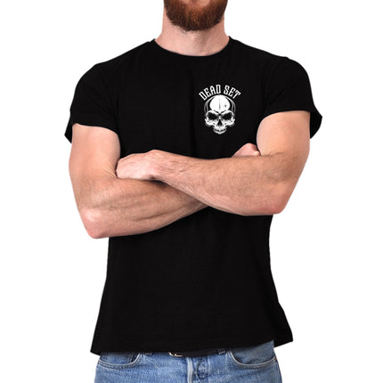 Man in the black Loyal to the Grave skull t-shirt with arms crossed, small skull logo on the chest