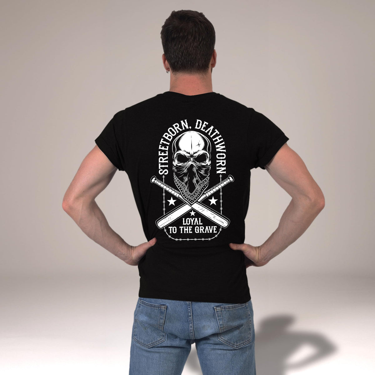 Back view of the Loyal to the Grave skull t-shirt in black worn by a man