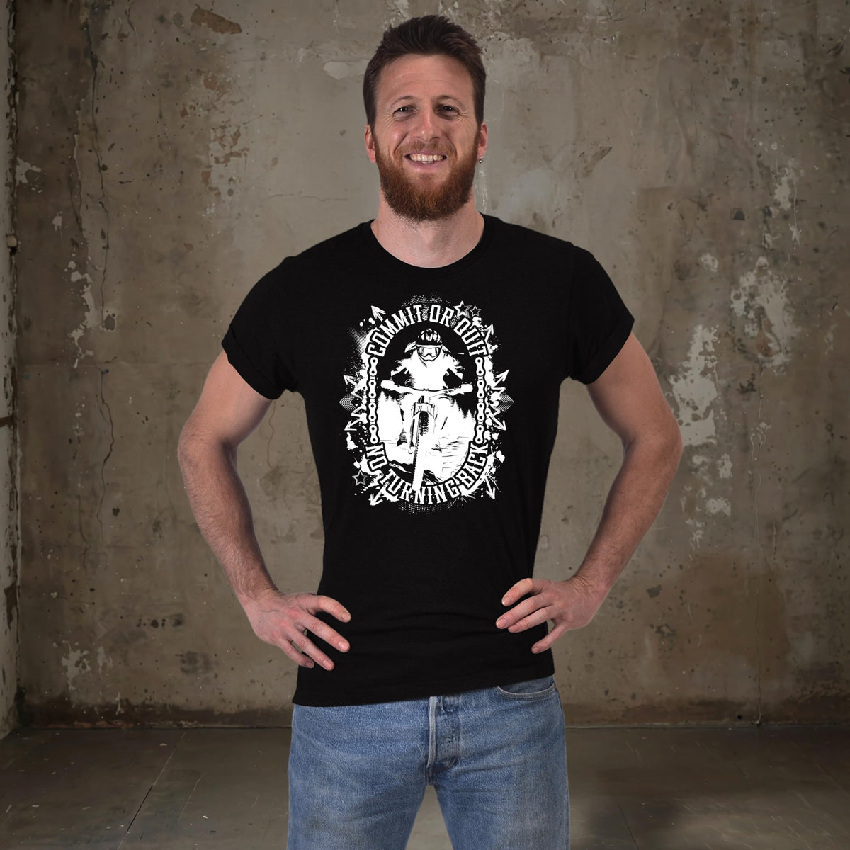 Man in the black Commit or Quit mountain bike t-shirt with hands on hips
