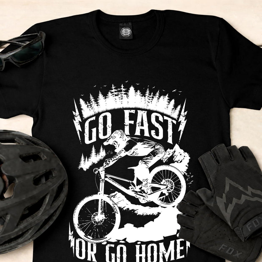 Close-up of the Go Fast or Go Home print with a bike helmet and gloves