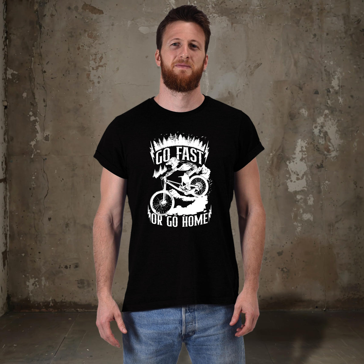 Smiling man in the black Go Fast or Go Home mountain bike t-shirt