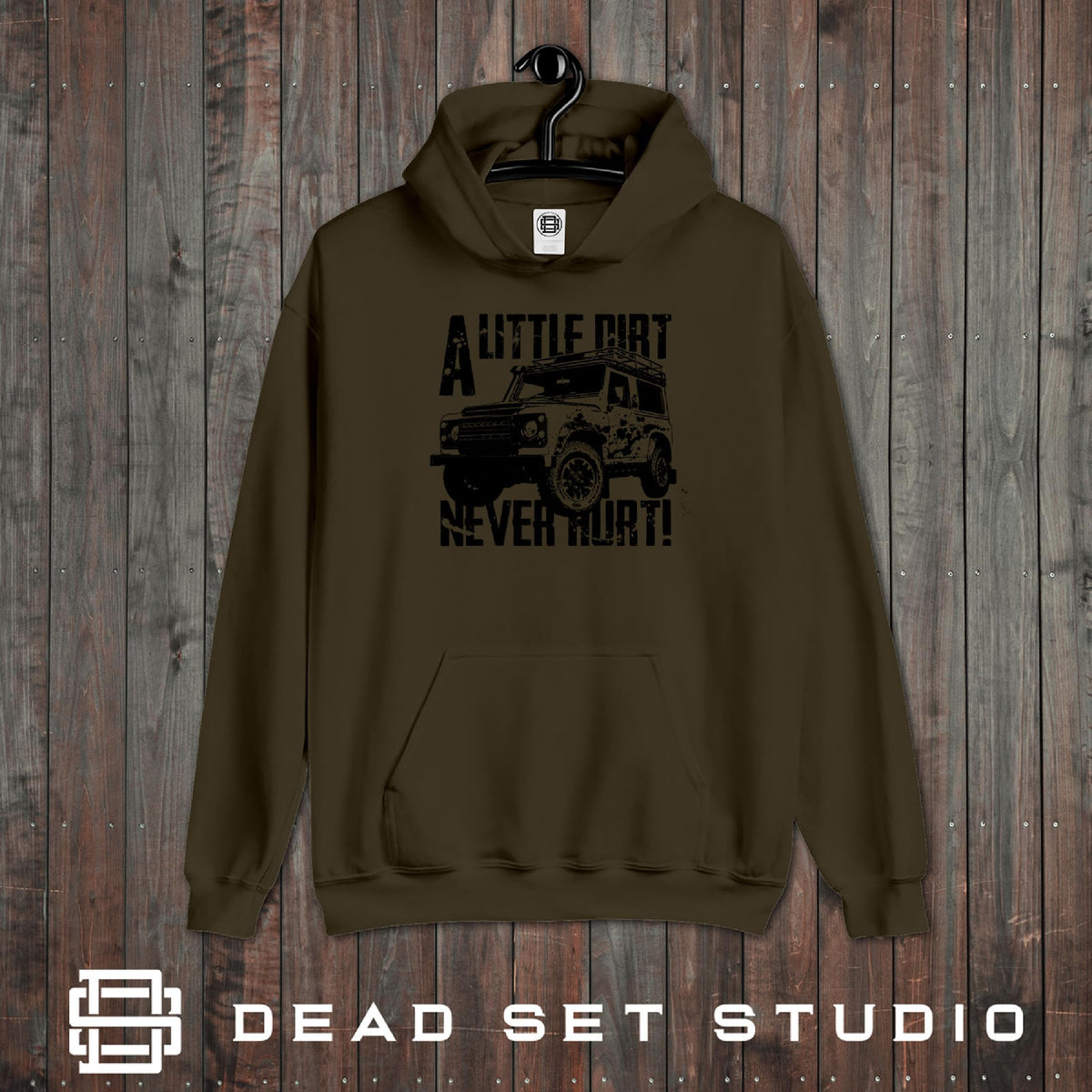 A Little Dirt Never Hurt off road 4x4 hoodie in olive on a rustic wood background