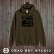 A Little Dirt Never Hurt off road 4x4 hoodie in olive on a rustic wood background