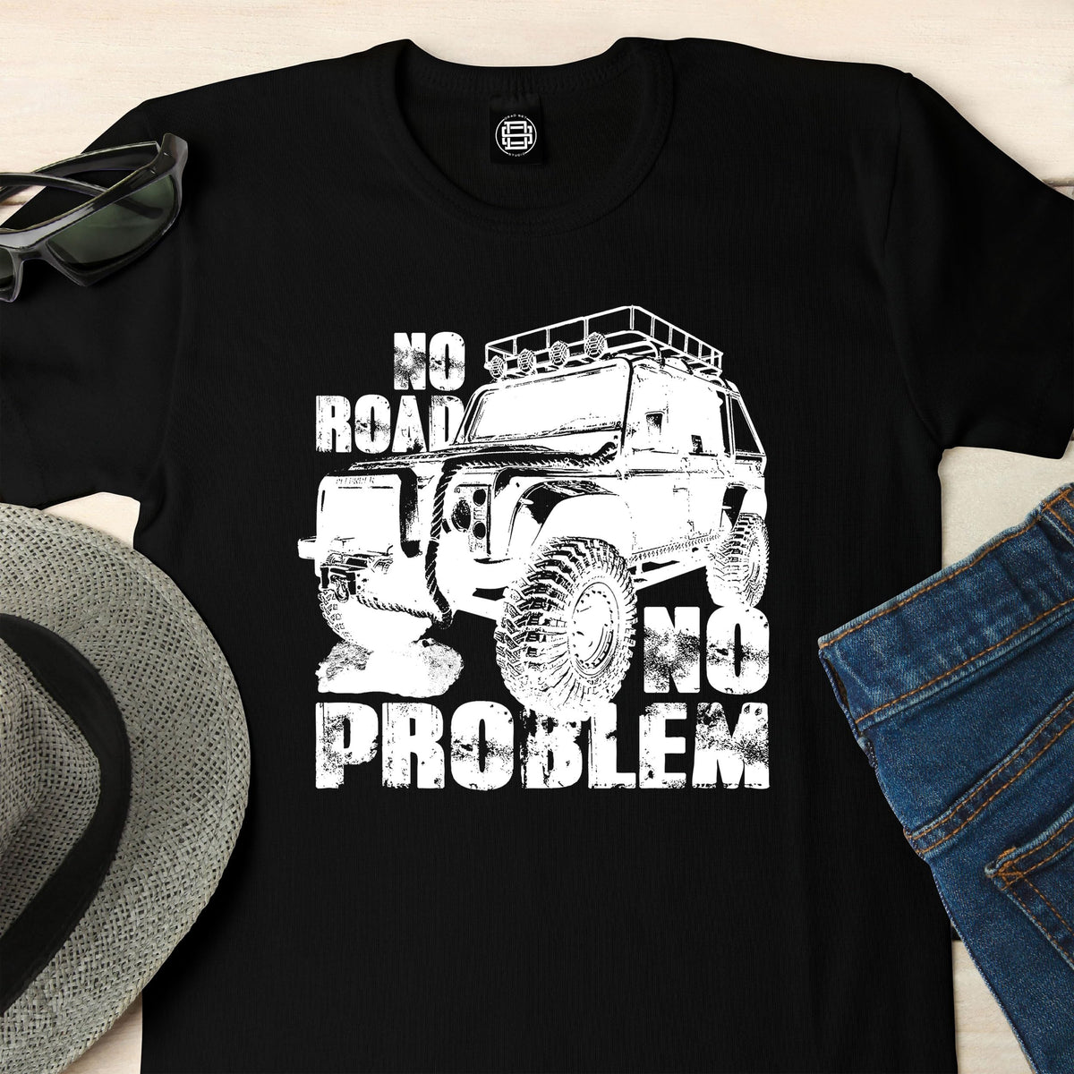 Close-up of the No Road No Problem print on a black off road 4x4 t-shirt