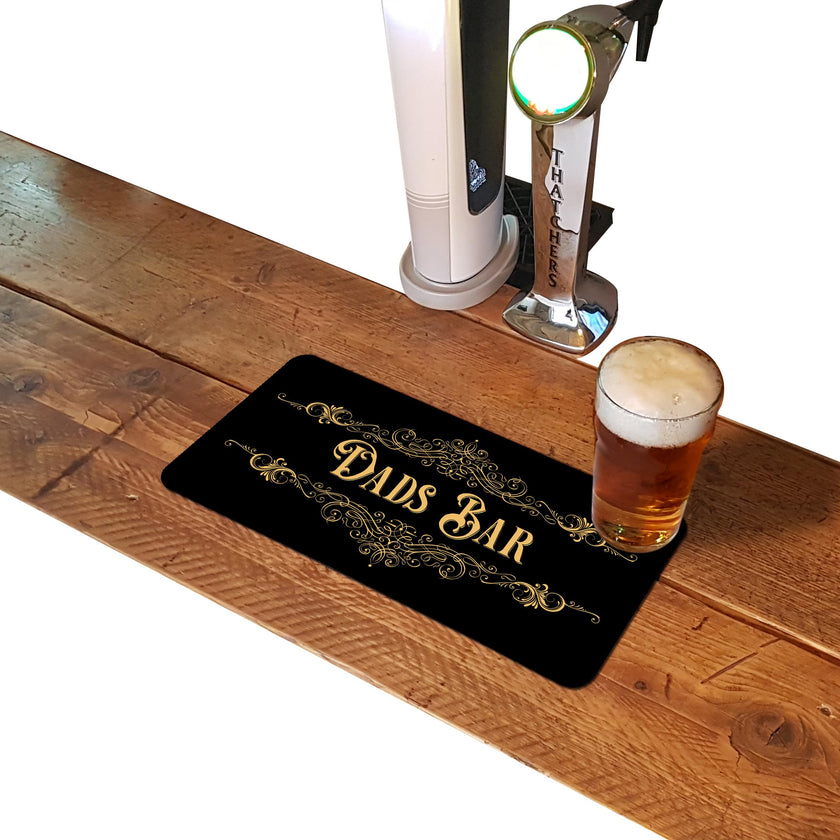 Dads Bar gold rubber bar runner mat on a home bar counter