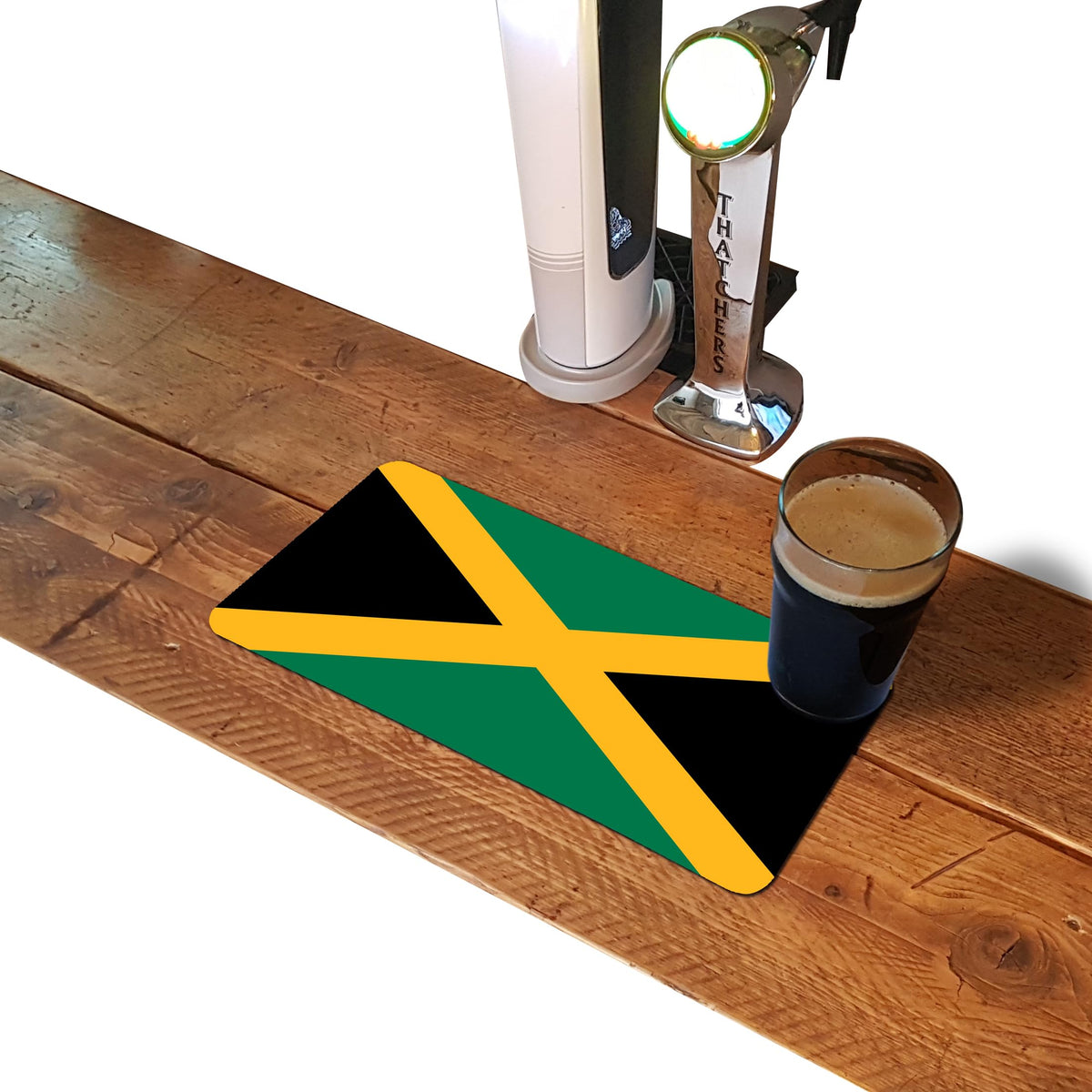 Jamaican flag rubber bar runner mat on a home bar counter