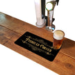 Pisshead Corner rubber bar runner mat on a home bar counter