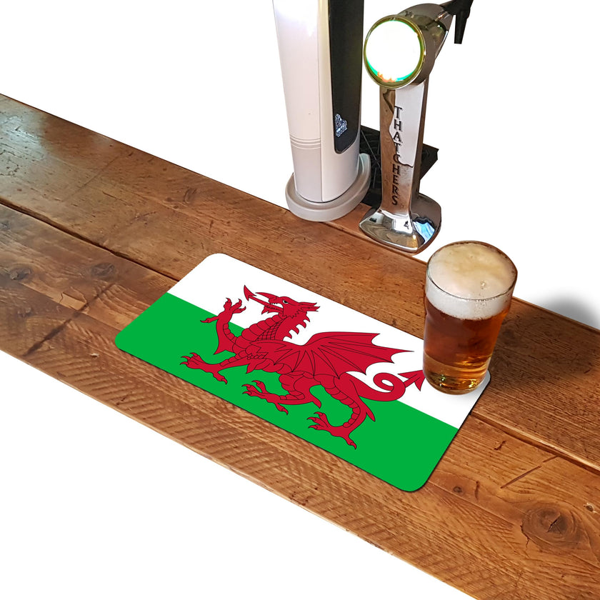 Welsh flag rubber bar runner mat on a home bar counter